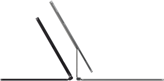 Dos iPad Pro acoplados al Magic Keyboard, lateral exterior, diseño ultrafino, color negro espacial con altavoces y el conector USB-C, uno semiabierto, color plata, otro abierto, inclinado hacia atrás para mostrar el diseño con apoyo flotante del teclado, los altavoces y el micrófono